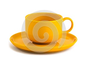 Yellow cup and saucer