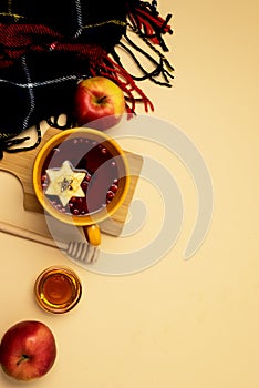 Yellow Cups of Hot Berry Tea with Apples on Wooden Cutting Board Scarf Honey Autumn Home Comfort Concept Top View Yellow