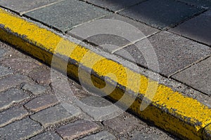 Yellow curb stone border