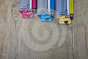 Yellow, cyan and magenta toner cartridges on wooden table