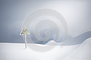 Yellow danger sign in mountains