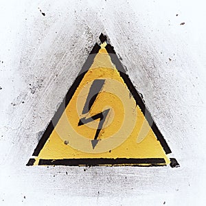 Yellow Danger Sign on White Weathered Background
