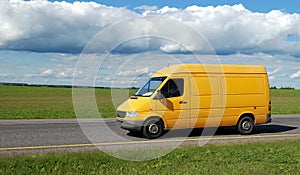 Yellow delivery truck photo