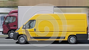 Yellow Delivery Van Alongside a Cargo Truck with a Maroon Cab