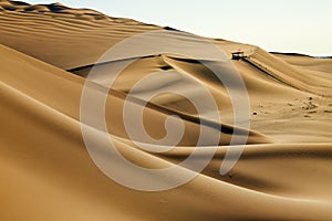 The yellow desert wave and blue sky sunset in Tulufan city