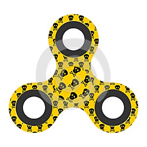 Yellow design fidget spinner with bearing with black skull. Modern children`s hand spinning toy on white background