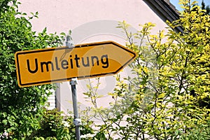 Yellow detour road sign, Germany. photo