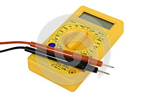 Yellow digital multimeter on white background, electronic measuring equipment