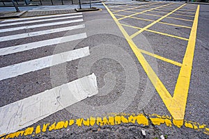 Yellow dividing lines on dark asphalt, abstract road marking background photo texture