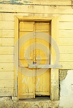 Yellow door greece old house