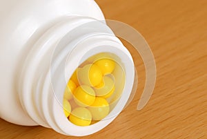 Yellow dragee pills