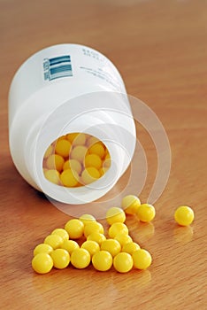 Yellow dragee pills