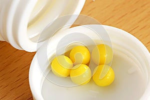 Yellow dragee pills