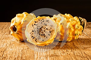 Yellow Dragon Fruit Isolated on a Table with balck background