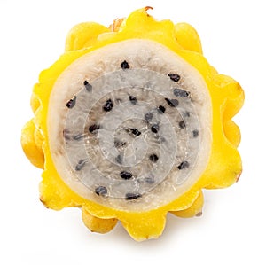 Yellow dragon fruit slice with white flesh and crunchy black seeds on white background photo