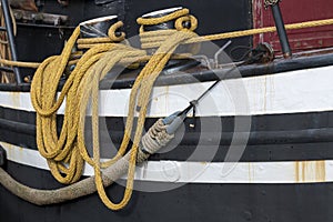 Yellow draped rope to a fishing boat