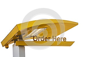 Yellow drive through resturant light and sign saying Order Here - isolated on white and room for copy