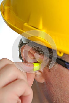 Yellow earplug into the ear