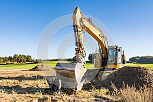 Yellow earth mover at a construction site