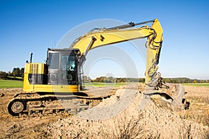 Yellow earth mover at a construction site