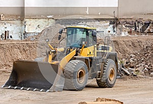 Yellow earth mover at a construction site