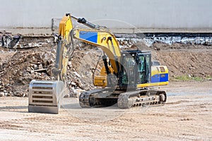 Yellow earth mover at a construction site