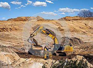 Yellow earth mover at a construction site