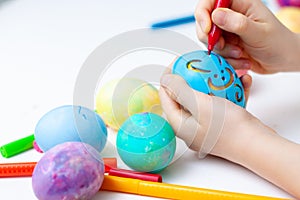 Yellow egg, colorful markers Rabbit pattern, template for egg. Happy family is preparing for Easter and painting eggs. copy space