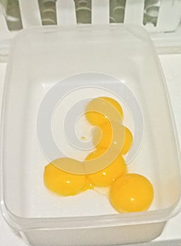 Yellow egg yolks separated from the egg whites