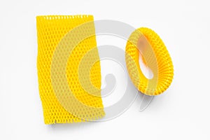 Yellow EPE fruit nets close-up isolated. Expanded polyethylene foam mesh for Fruit Wrap To prevent bumps.