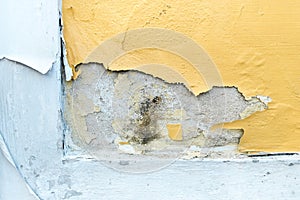 yellow erode painted concrete wall,grunge rough texture background photo