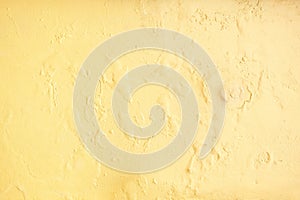 yellow erode painted concrete wall,grunge rough texture background photo