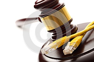 Yellow ethernet cable and gavel