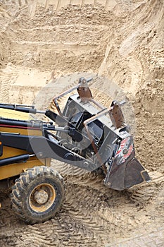 Yellow excavator construction site