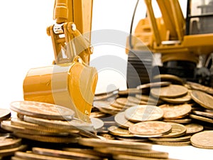 Yellow excavator digging a heap of coins