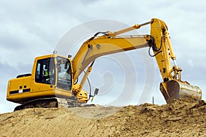 Yellow excavator machine photo