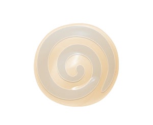 Yellow face cream, retinol serum swatch isolated on white. Beauty skincare product circle swirl closeup