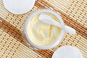 Yellow facial mask banana face cream, shea butter hair mask, body butter in the small white container. Natural skin care