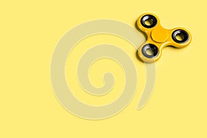 Yellow fidget spinner background template with copy space