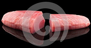 Yellow fin tuna steak isolated on black background. Fresh rare tuna steak isolated. Raw yellowfin tuna fillet texture. Background