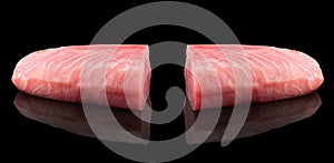 Yellow fin tuna steak isolated on black background. Fresh rare tuna steak isolated. Raw yellowfin tuna fillet texture. Background