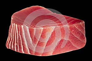 Yellow fin tuna steak isolated on black background. Fresh rare tuna steak isolated. Raw yellowfin tuna fillet texture. Backround