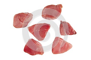 Yellow fin tuna steaks isolated on black background. Fresh rare tuna steaks isolated on black. Raw yellowfin tuna fillet texture.