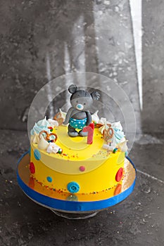 Yellow First Year Birthday Cake with bear. Children`s birthday cake.