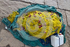 Yellow fishing nets, ropes and canister