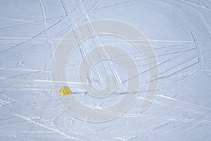Yellow fishing tent on a frozen lake