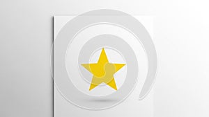 A yellow five pointed star is centered on a white square paper