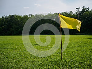 yellow flag at corner of soccer field. sport flag and sign concept.