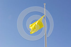 Yellow Flag at Half Mast