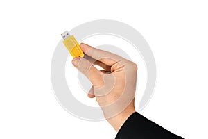 Yellow flash drive on hand with isolated white background